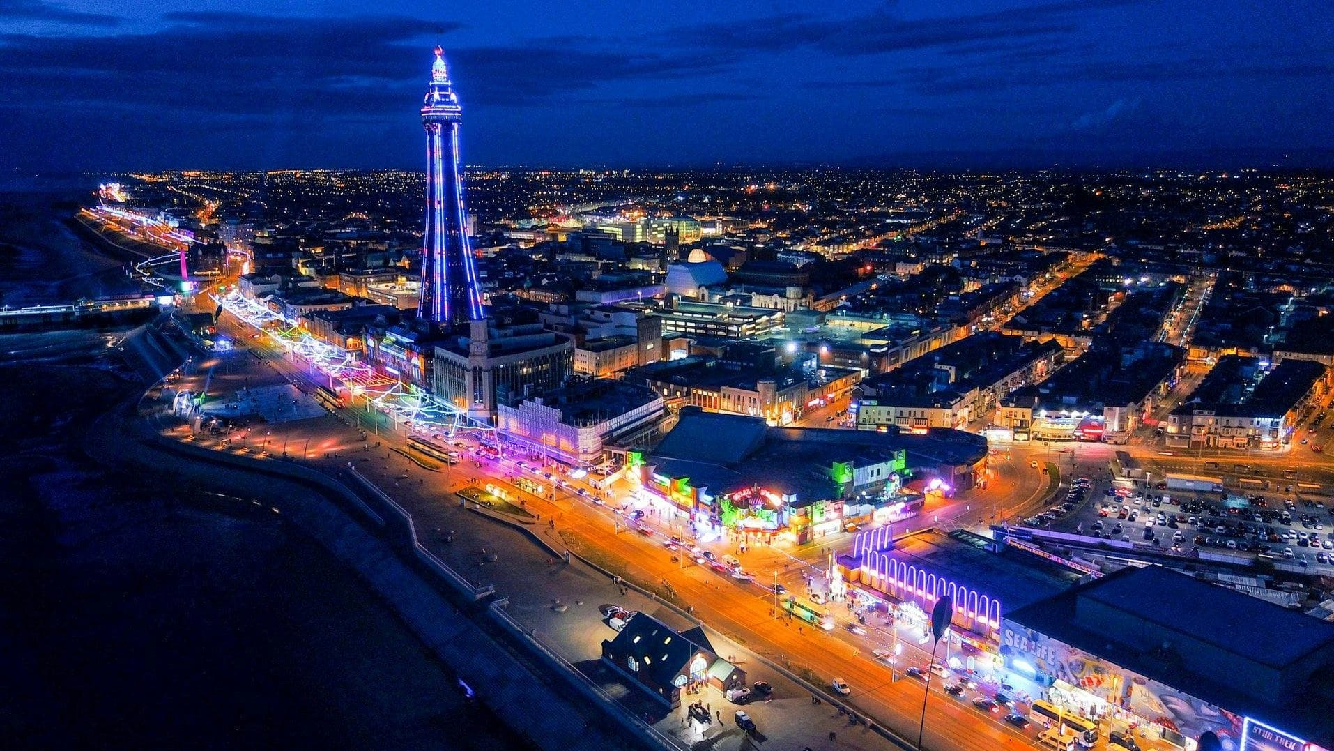 Blackpool, England at night with bright lights.