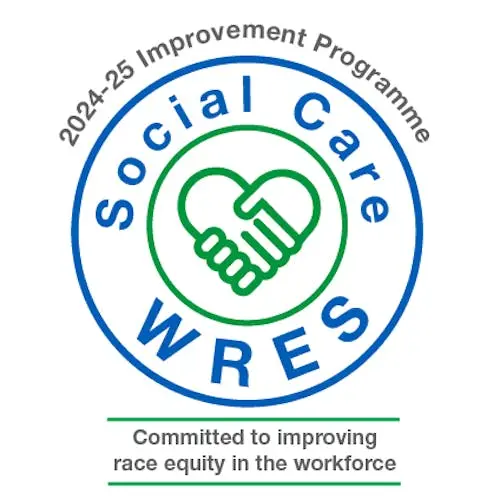 Logo of the Social Care WRES program, with a handshake and heart design.