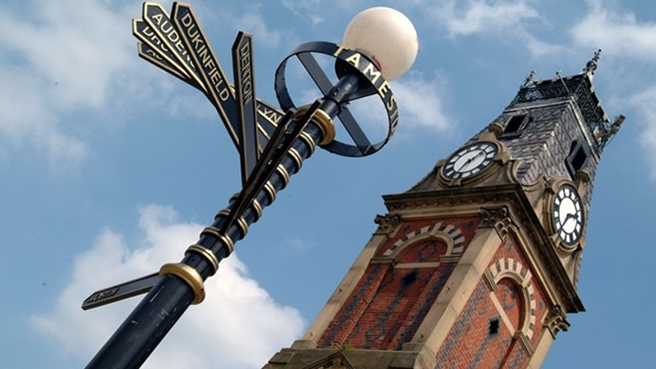 Directional signs and clock tower.