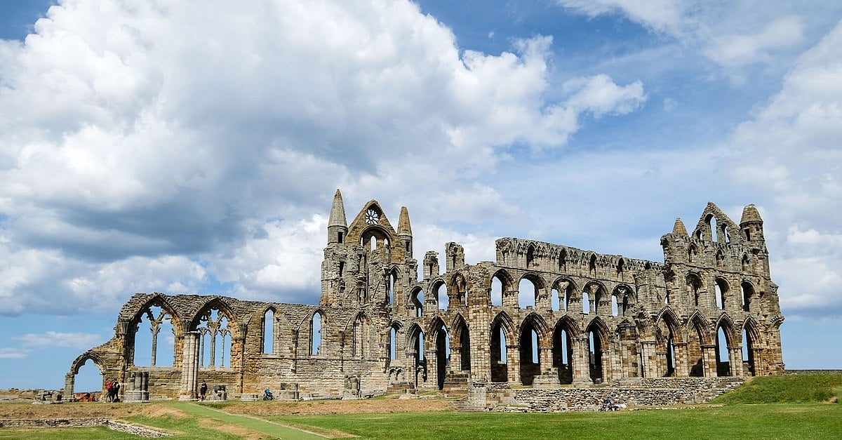 Ruins of Whitby Abbey, England. Cloudy sky above.