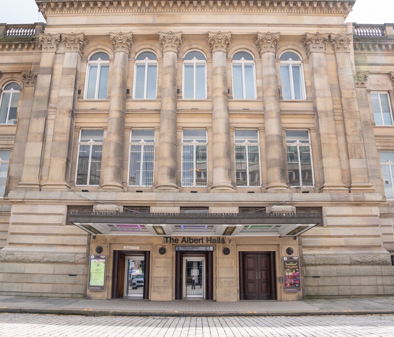 The Albert Halls building facade, large windows, pillars.