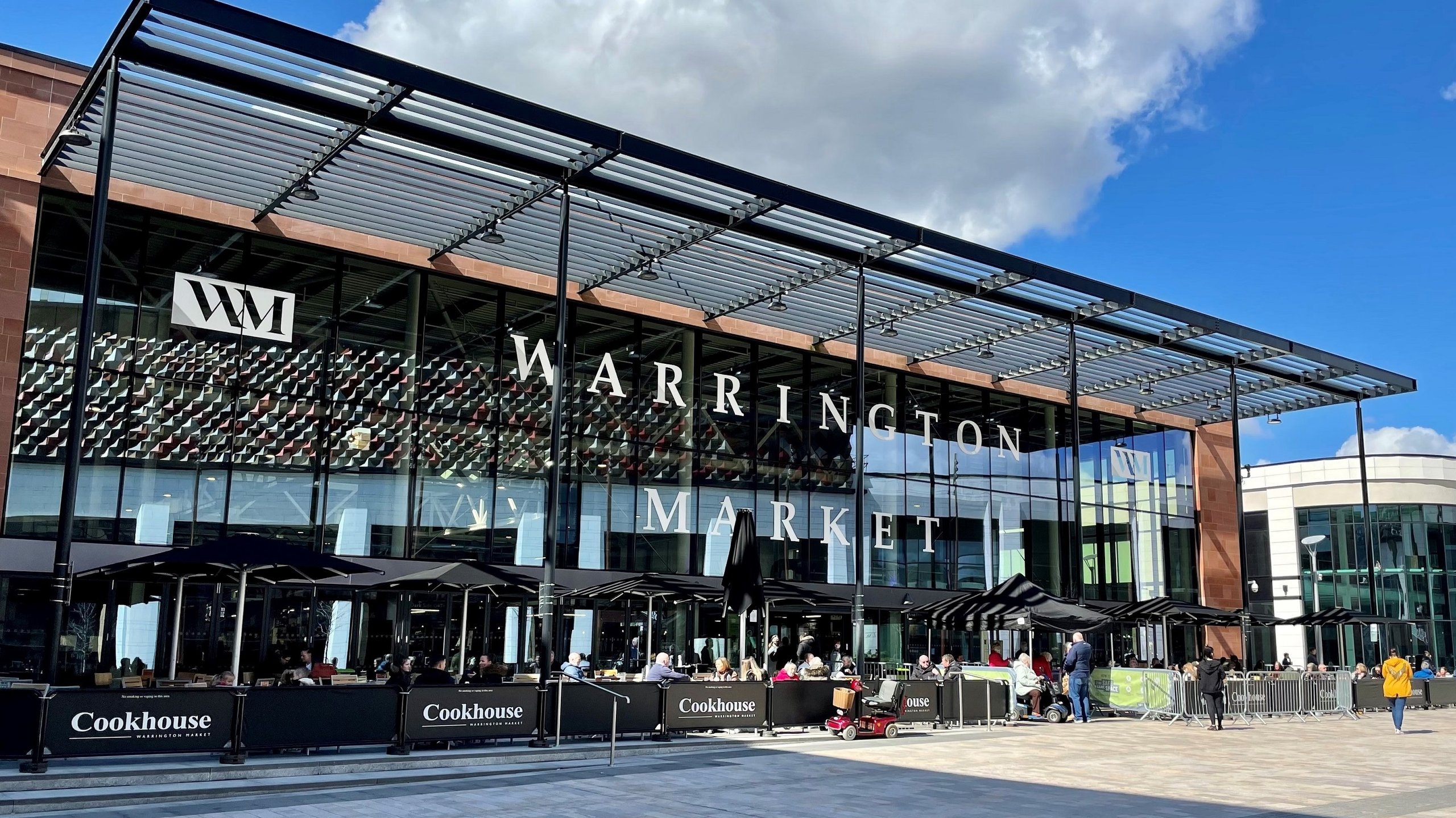 Exterior of Warrington Market with Cookhouse seating area.