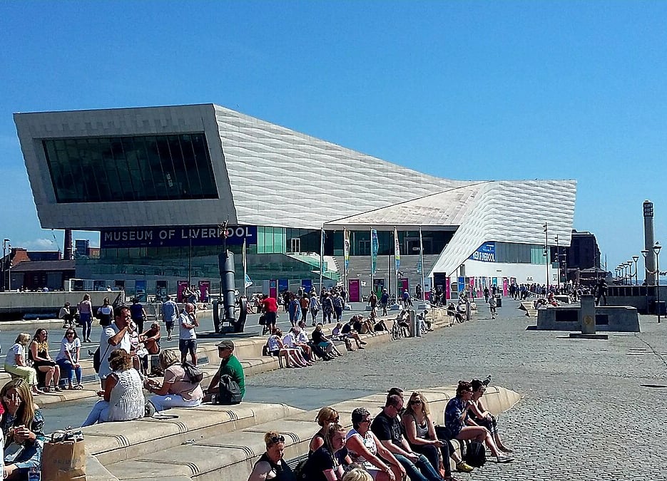 People near the Museum of Liverpool on a sunny day.