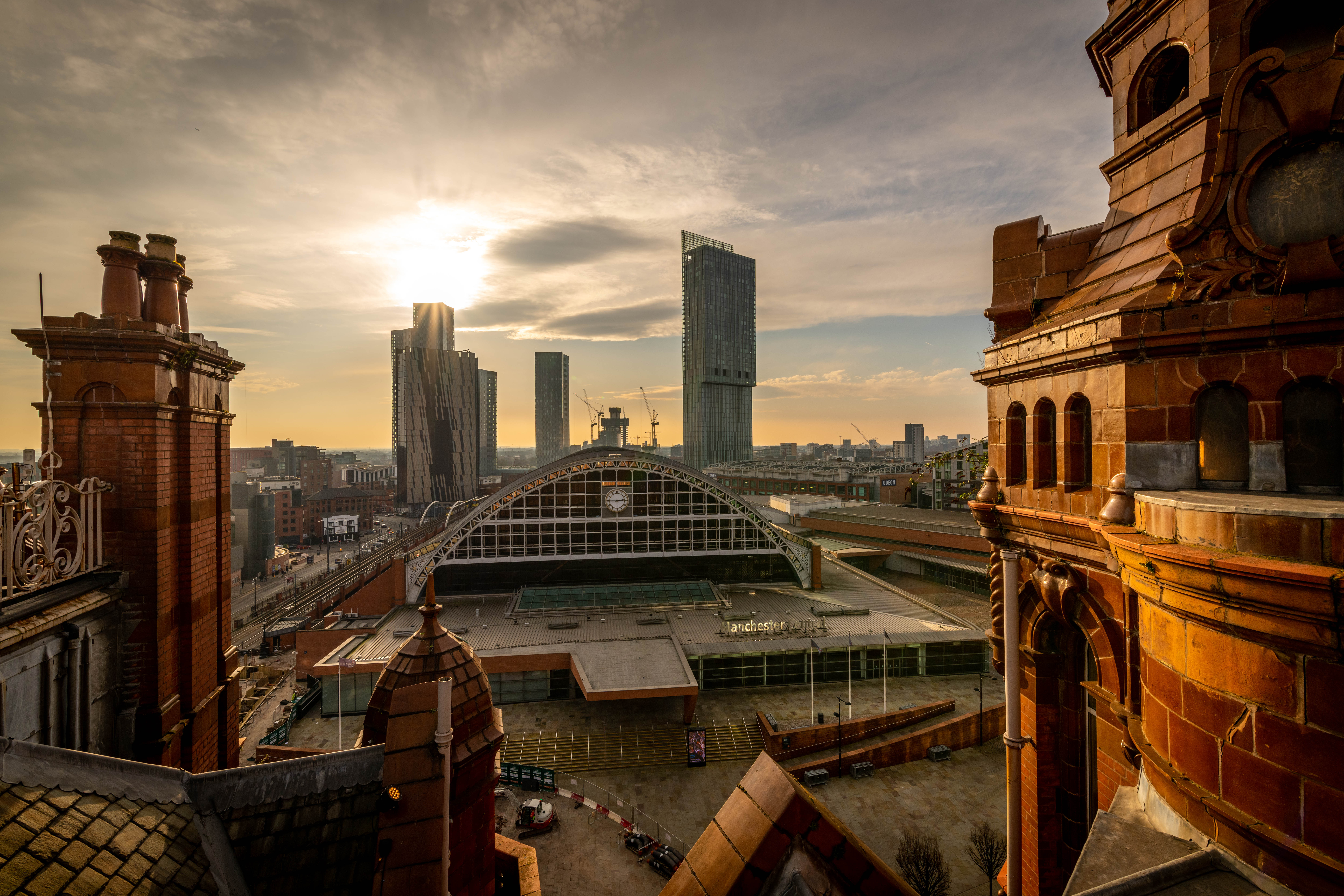 City view with trains and clock tower.