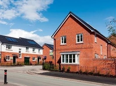 New houses in bright sunlight with blue skies.