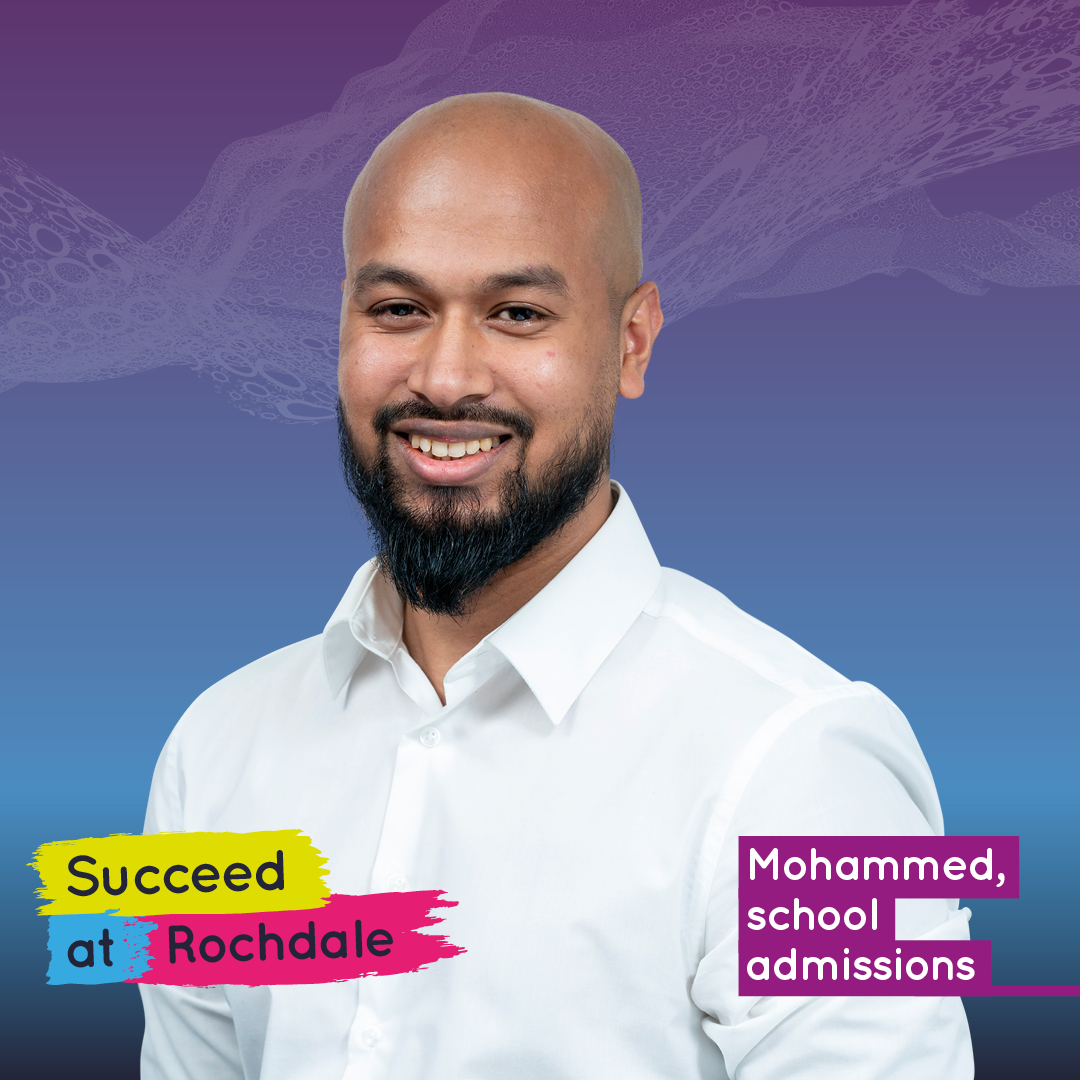 Man with beard smiling, school admissions advertisement.